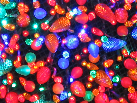 Coloured lights as taken from outside a glass window.